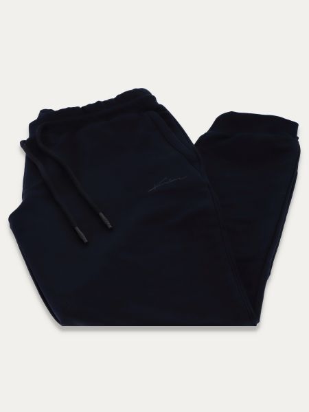 Granatowe dzianinowe spodnie dresowe slim z troczkami BLUE